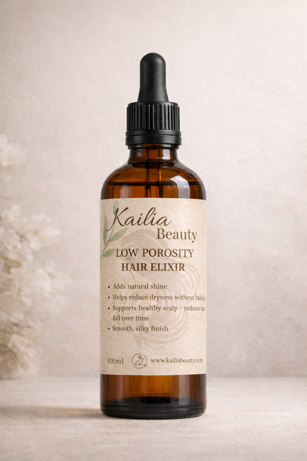 Kailia Beauty Low Porosity Hair Elixir bottle on a neutral background